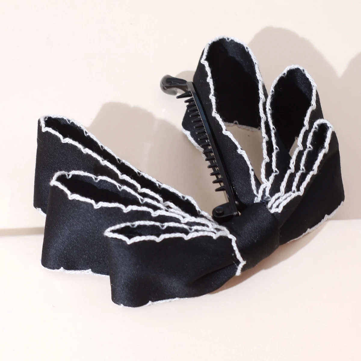 pince cheveux noeud tombant en tissu