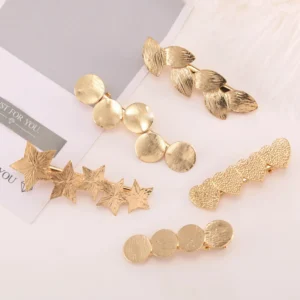 barrette cheveux métal or ou argent motifs géométriques et astres