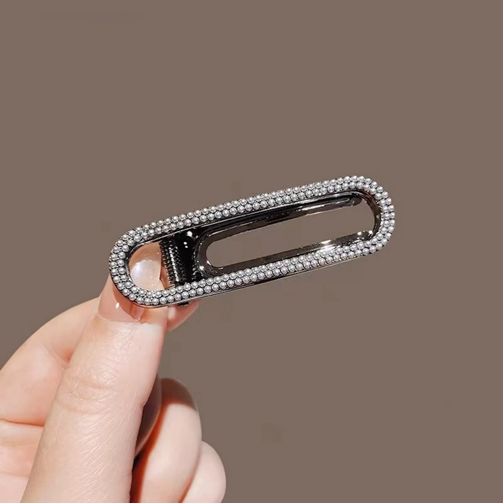 barrette cheveux en strass noirs pince bijou ovale en métal foncé